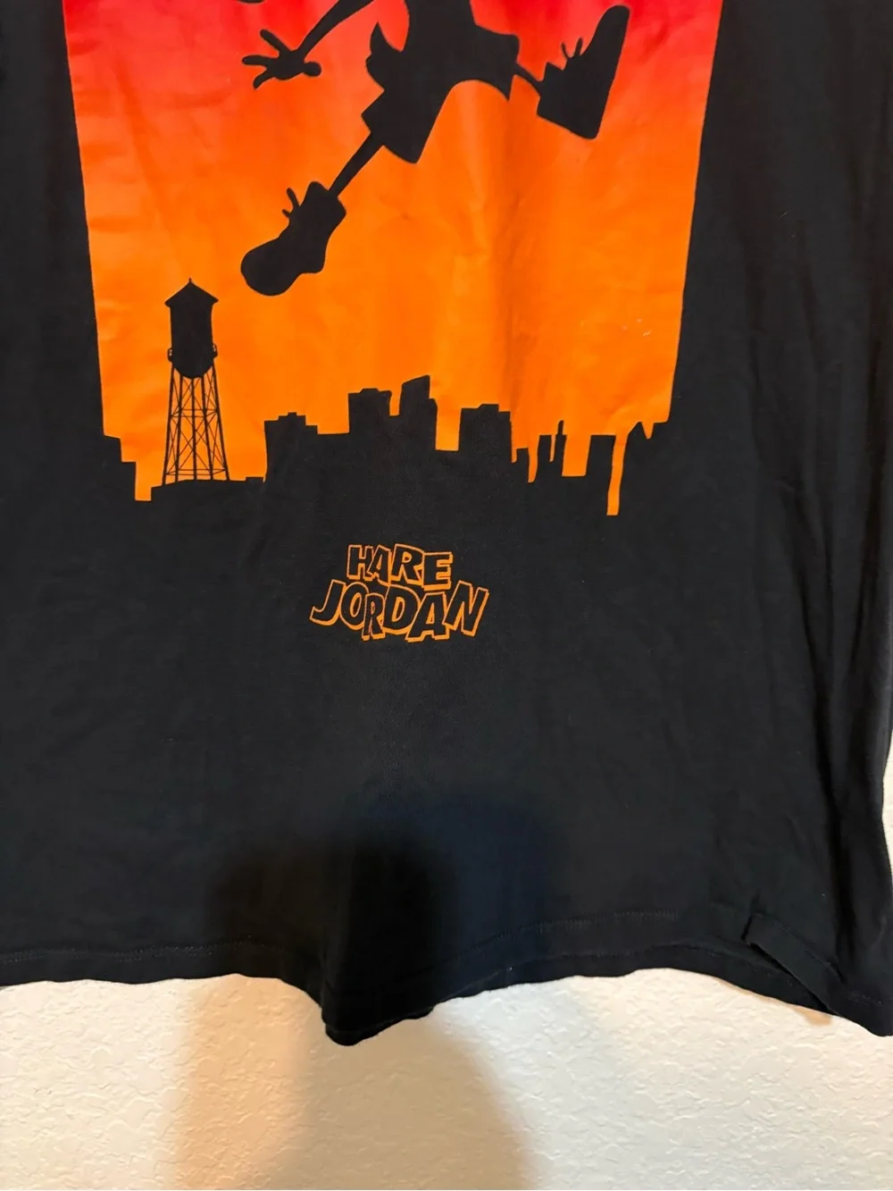 Jordan Hare Jordan Black Tee with Red-to-Orange Basketball Graphic